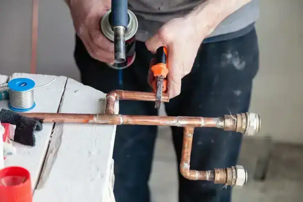 Master Plumber Reconstructing Split Copper Water Pipe with Solder, Torch and Brass Fittings